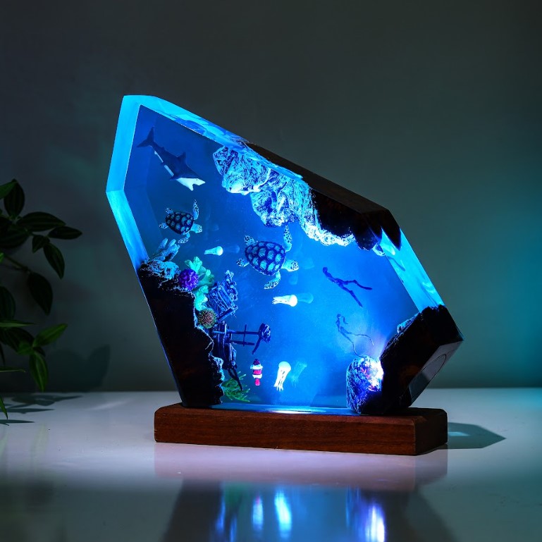 Orca and divers night light
