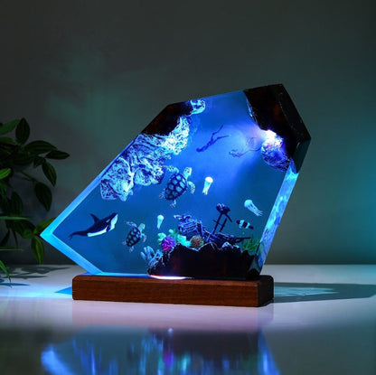 Orca and divers night light